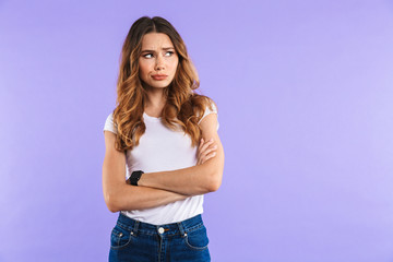 Wall Mural - Portrait of an upset young girl standing