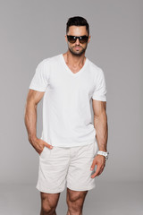 Wall Mural - Handsome man in summer clothes wear sunglasses