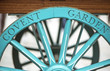Covent Garden written on the famous flower cart wheel, welcoming tourists