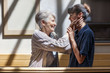 © Westend61 - Nurse embracing senior woman in retirement home