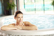 © sepy - Shot of a beautiful young woman relaxing at the beauty spa while sitting in the jacuzzi.