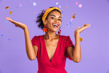 Poster - Joyful african woman in dress celebration under confetti shower