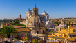 Photo of the sights and architecture of the centre of Rome from the roof of the historic building, day, summer: Forum, Catholic churches