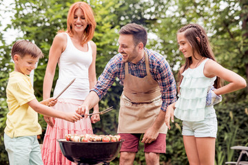 Wall Mural - Family having a barbecue party