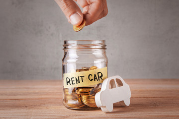 Canvas Print - Rent car. Glass jar with coins and an inscription of rent car and symbol of car