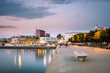A promenade by the sea in harbour in the city of Koper, Slovenia after sunset