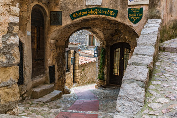 Poster - Eze, France - April 20, 2016: Old buildings and narrow streets in the picturesque medieval city of Eze Village in the South of France along the Mediterranean Sea