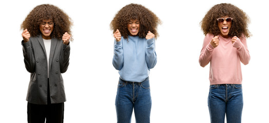 Poster - African american young woman wearing different outfits excited for success with arms raised celebrating victory smiling. Winner concept.