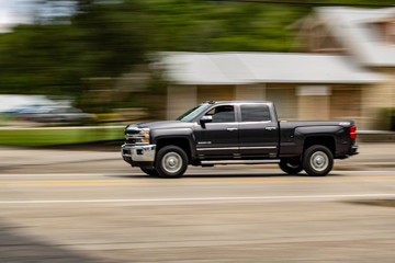 Black 4 door pick up truck