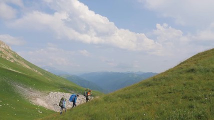 Wall Mural - hiking people walking on mountain on background green hills and highlands