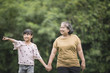 © Johnstocker - Grandmother Playing With Granddaughter Outdoors At The Park