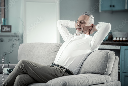 Relaxed Atmosphere Delighted Bearded Male Person Sitting On The