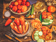 © Михаил  - different tomatoes and sweet pepper on a wooden background. rustic food.