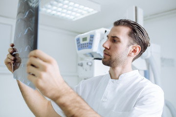 Wall Mural - Technician Examining X-ray Films