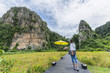 © Sirirat Makprasert - The women relaxed and enjoying the nature at Noen Maprang of Phitsanulok district,Thailand  in mountains with exciting view of  mountainous, back view.Traveler and holidays, Backpacker concept.