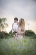 © Johnstocker - Mother and little daughter playing together in a park