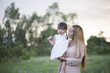 © Johnstocker - Mother and little daughter playing together in a park