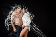 © LIGHTFIELD STUDIOS - side view of seductive couple with water splash isolated on black