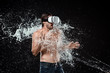 © LIGHTFIELD STUDIOS - shirtless man in vr headset swilled with water isolated on black