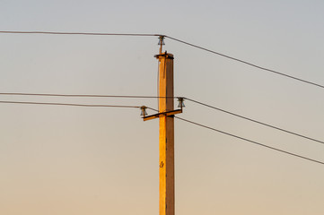 Electrical pole and wires against the sky