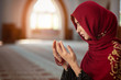 © FS-Stock - Young muslim woman praying in mosque with quran