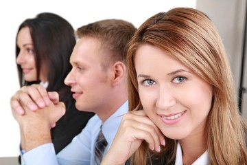 Poster - Young Woman in the Background of Co-Workers - Isolated