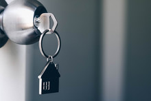Property Concept, Home Key With Metal House Keychain In Keyhole