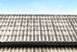 Fototapeta  - roof wavy tile, roofing tile old, white or grey roofing tile old on sky background