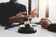 © Jirapong - notary consultant concept , focus Judge gavel with client negotiation or discussion lawyer lawsuit bankruptcy of business her. Concepts of law.