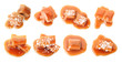 Set with delicious caramel candies and sauce on white background, top view