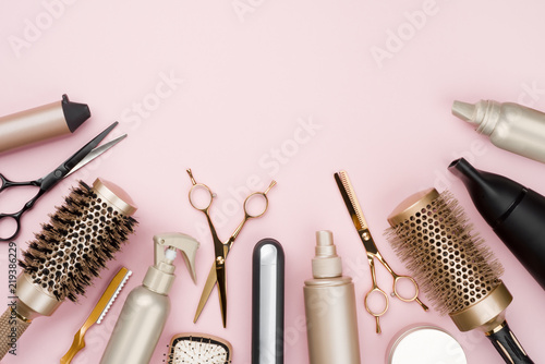 various-hair-dresser-tools-on-pink-background-with-copy-space