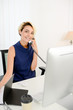 © W PRODUCTION - beautiful young business woman working at desk in a white and bright office
