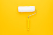 clean paint roller on the yellow background