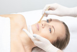Fototapeta  - Waxing woman leg. Sugar hair removal. laser service epilation. Salon wax beautician procedure