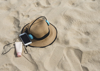 Sunscreen, hat On the beach in summer.