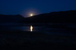 © yaroslav1986 - lake  in mountains at night in full moon light