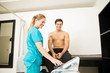 © AntonioDiaz - Smiling Athlete Getting Electrotherapy From Physical Therapist