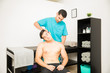 © AntonioDiaz - Physical Professional Stretching Patient's Neck For Pain Relief