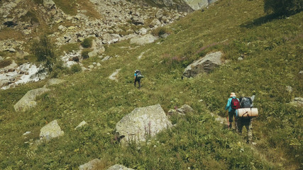 Wall Mural - drone view tourist family traveling on background mountain river. hiking group