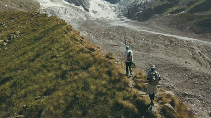 Wall Mural - drone view hiking people traveling a mountain. tourist group climbing a mountain