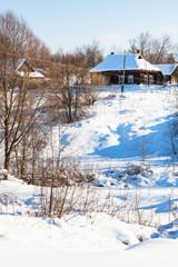 Sticker - ravine and little russian village in winter