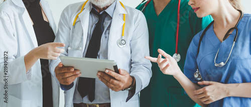 Cuadros en Lienzo Group of doctor with tablet on white background