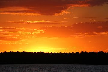 Wall Mural - Sunset on a northern Minnesota lake in July