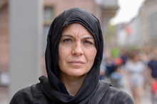Serious Middle Aged Woman Wearing A Head Scarf