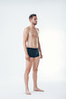 © GVS - Full length portrait of a young sexy muscular male model in underwear