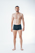 © GVS - Full length portrait of a young sexy muscular male model in underwear