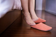 Relaxation and Comfortable Concept. person Waking up in the Morning and put on Slipper Shoes in Bedroom