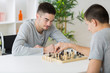 © auremar - two young man playing chess