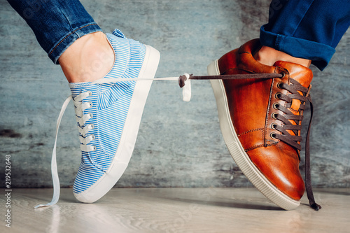 Cuadros en Lienzo Male and female shoes go in different directions and tied with laces