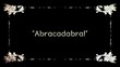 A re-created film frame from the silent movies era, showing an intertitle text: abracadabra (a word used when performing magical tricks), with quotes.
